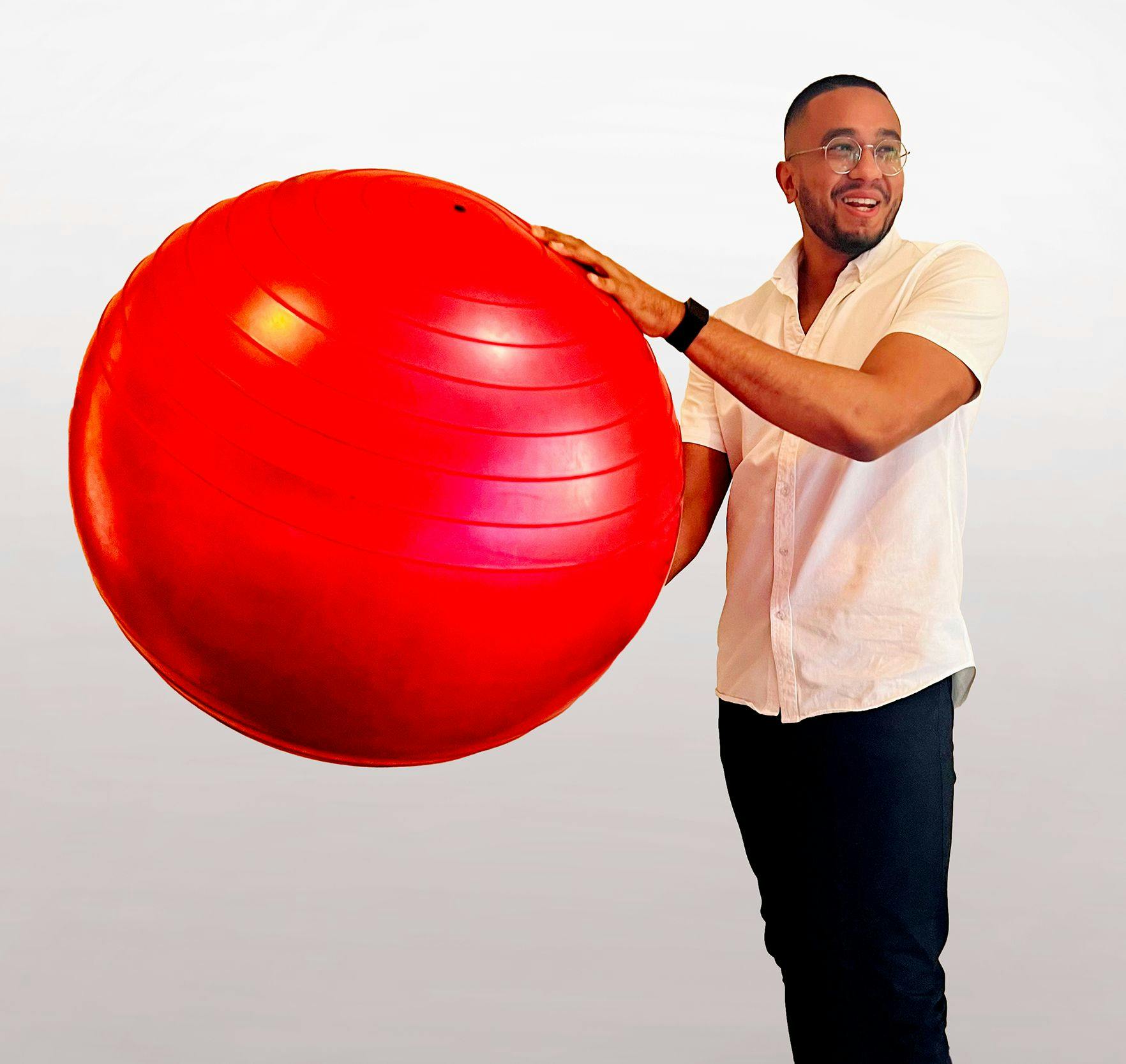 Jean-Marc holding a red fit ball